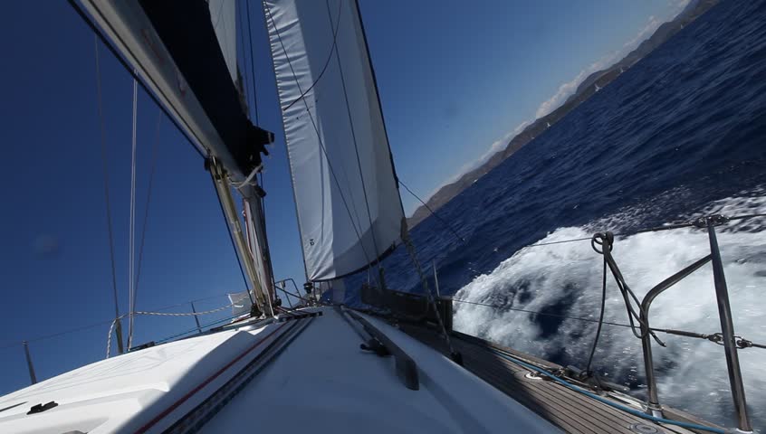 Sailing in the wind through the waves (HD) Sailing boat shot in full HD at the Mediteranean sea.