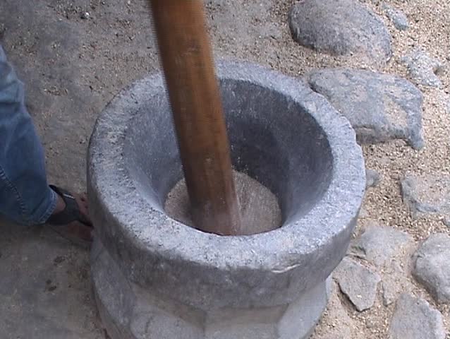 Pounding rice in the stone mortar
