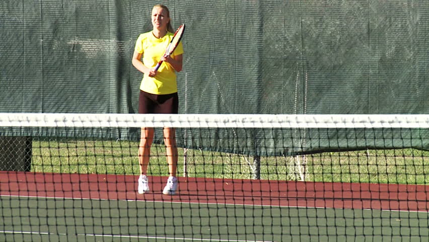 Girl playing tennis in slow motion