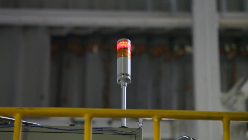 Red and orange alarm siren is glowing red light, meaning that there is trouble in manufacturing process. 
This video is loopable and can be adjusted to any length
