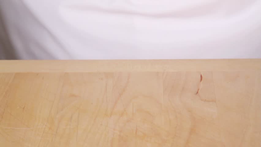 Finely chopping a skinned, deseeded tomato