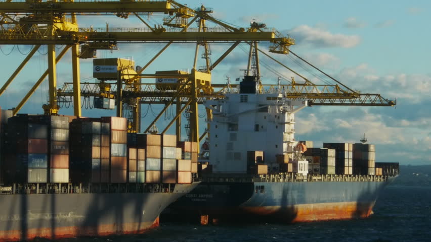 SYDNEY - CIRCA JUNE 2012: Two container ships are loaded by crane at Port Botany circa June 2012 in Sydney, Australia.
