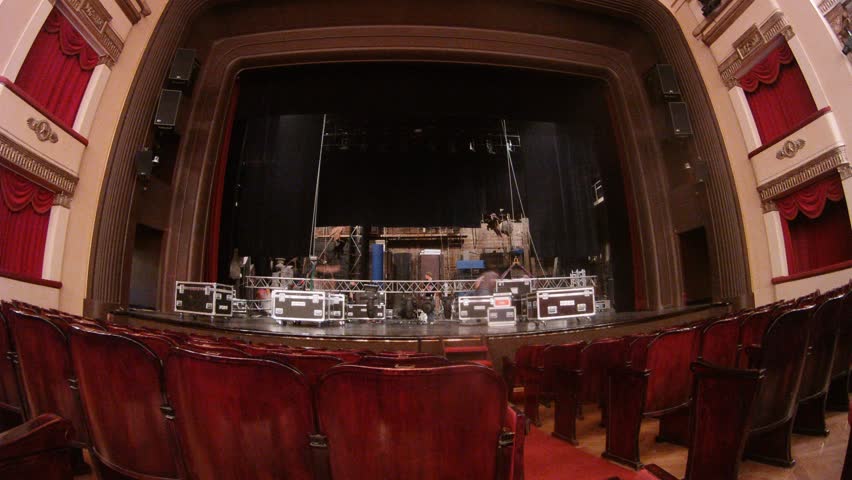 Working scenes dismantle scenery in black boxes in theatre, time lapse