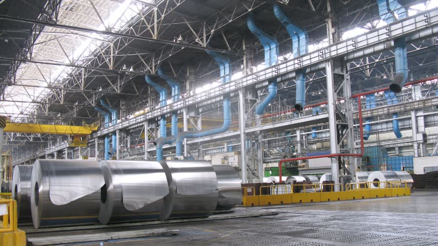Rolls of aluminum lie in production workshop of plant, time lapse