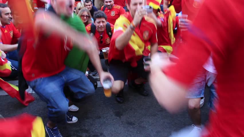 KIEV, UKRAINE - 1 JULY 2012: Spanish football fans in red shirts before final match of European Football Championship "EURO 2012" (Spain vs Italy), Kiev, Ukraine, July 1, 2012.