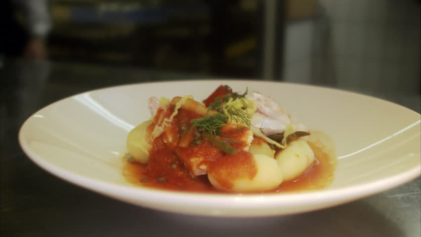 The preparing of food in a restaurant kitchen