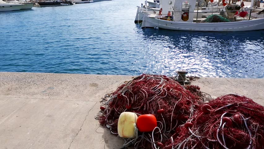Balearic islands formentera port with trammel fisher nets buoys and fishingboats in background