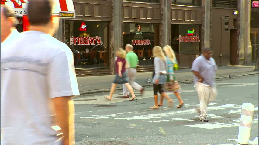 New York, NY - CIRCA 2006: A busy intersection in Manhattan shows how cars and pedestrians live in harmony