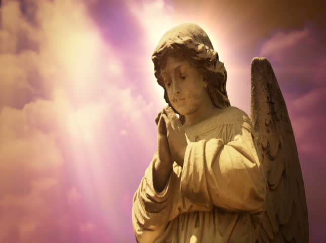 NTSC - Worship 0104 - The statue of an Angel on sunsetting clouds (Loop).