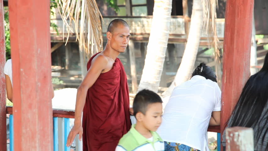 INLE LAKE, MYANMAR - APRIL 20: Visitors inside Nga Phe Kyaung Monastery  on April 20, 2012 on Inle lake, Myanmar. Inle lake isone of  the most popular place to visit in Myanmar.