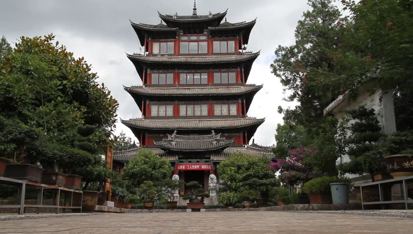Tall buddhist pagoda on the top of hill in Dali, China