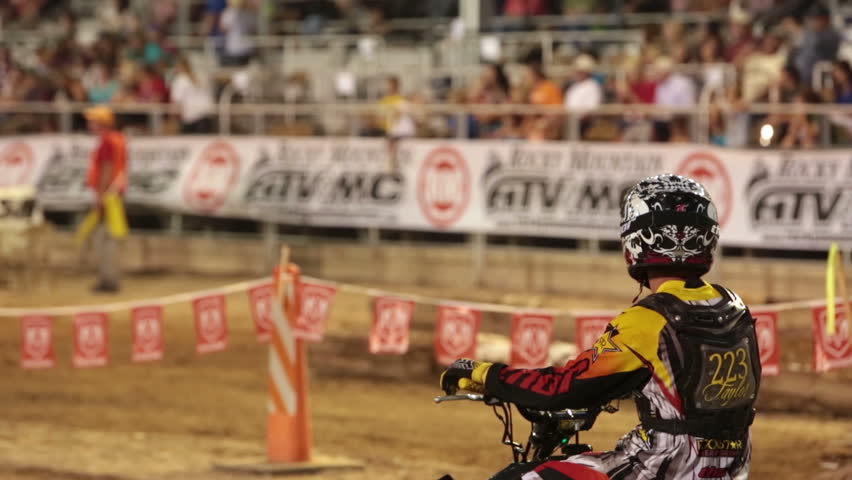 NEPHI, JUAB, UTAH 30 JUN 2012: Economic boost to rural community in annual race.  ATV 4 wheel rider waiting to race motocross. Juab County extreme enduro. Difficult obstacle with jumps, logs, rocks 