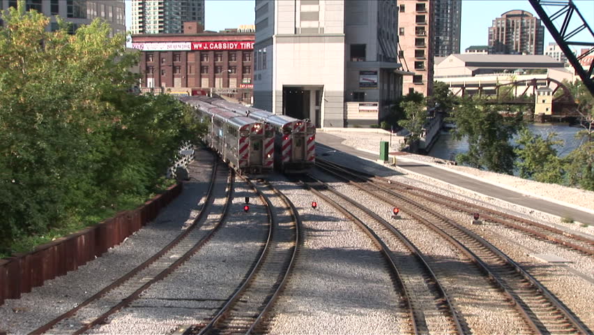 Chicago, IL - CIRCA September 2007: View of two commuter trains leaving the station to start bringing workers to where they need to be