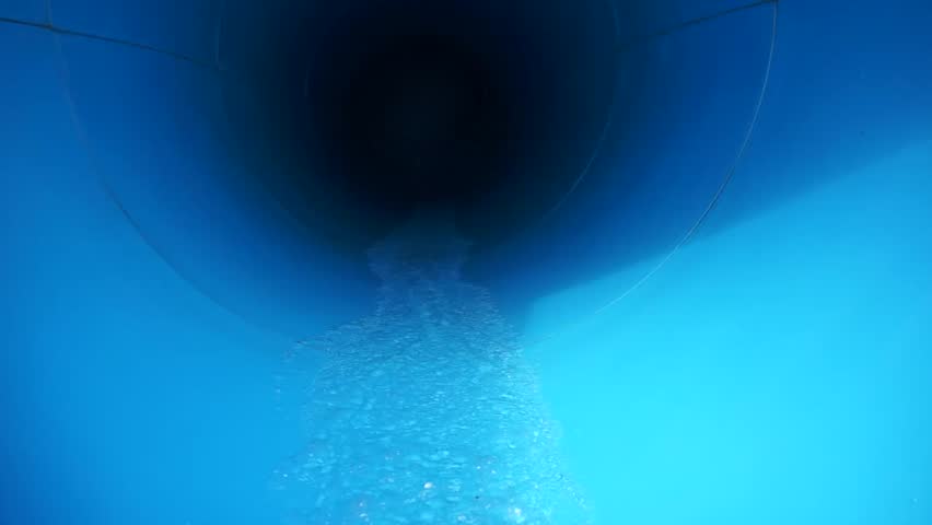 Sliding down tunnel at the water amusement park.