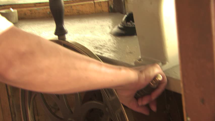 Close Up of Captain At The Wheel Of A Traditional Amazona River Ferry Boat