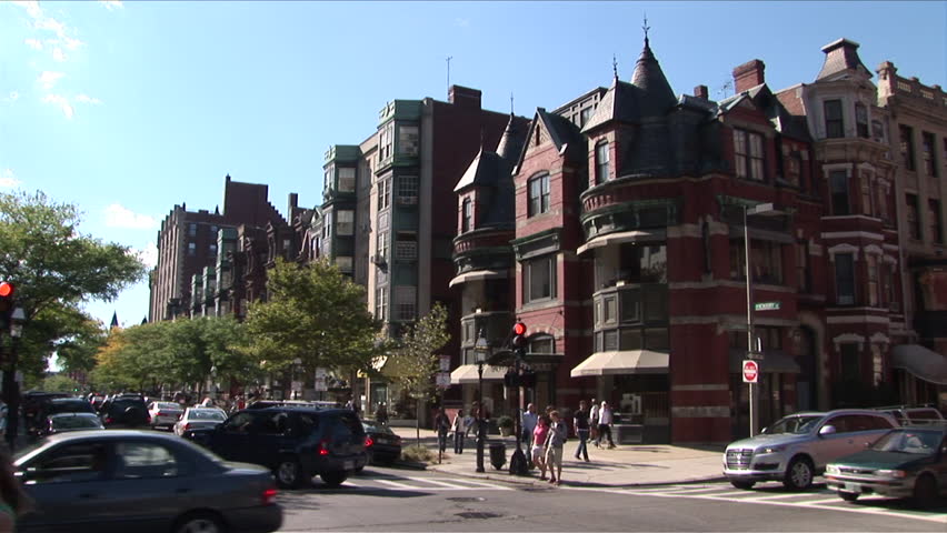Boston, MA - CIRCA March, 2006: Cars and people make their way around a busy intersection in the old part of town during the day