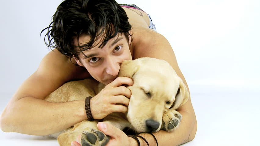 man saying hello with puppy dog labrador