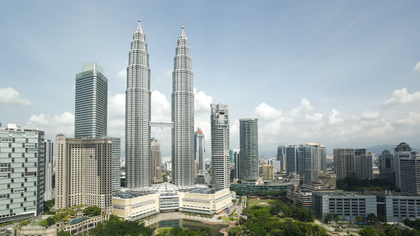 KUALA LUMPAR - CIRCA MAY 2011: Cloudscape view of the Petronas Twin Towers, Kuala Lumpur City Centre KLCC
