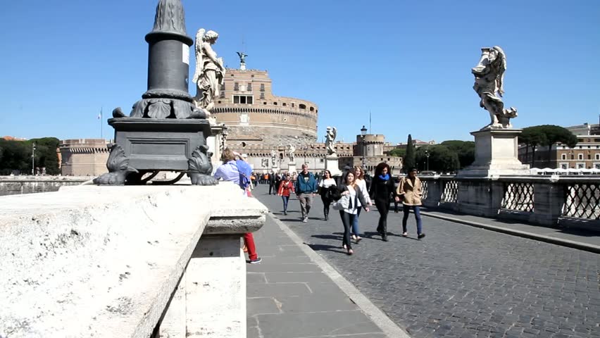 ROME - APRIL 9: Tourists walk along Saint Angel Bridge on April 9, 2012 in Rome. Rome is 14th most visited city in the world (5.6m international arrivals in 2010).