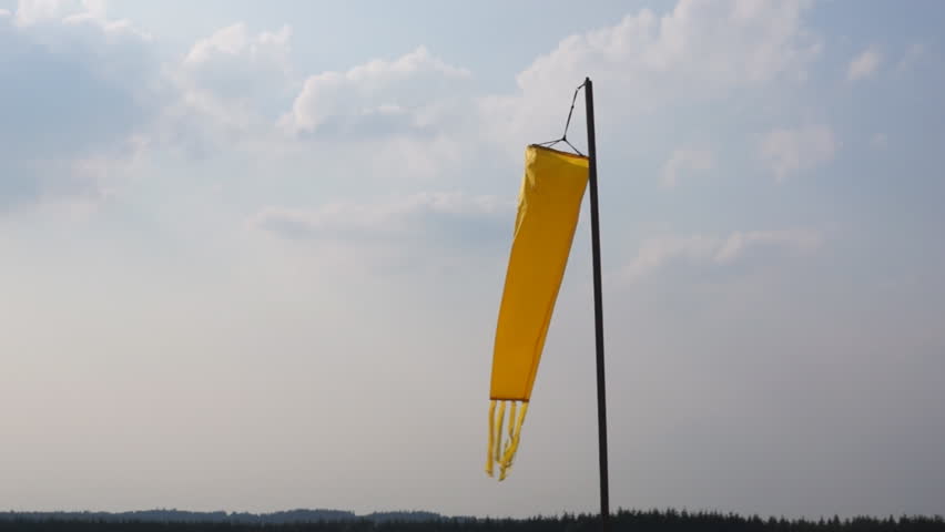 Yellow windsock in small gust of wind