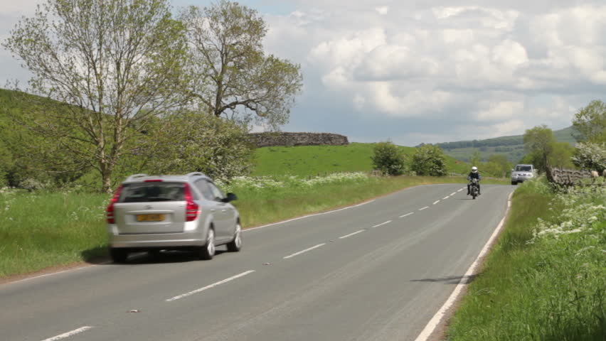 WHARFEDALE, YORKSHIRE/ENGLAND - JUNE 4: Traffic rushes through the peace and quiet of the countryside on June 4, 2012 in Wharfedale. The Yorkshire Dales National Park is famous for its tranquility.
