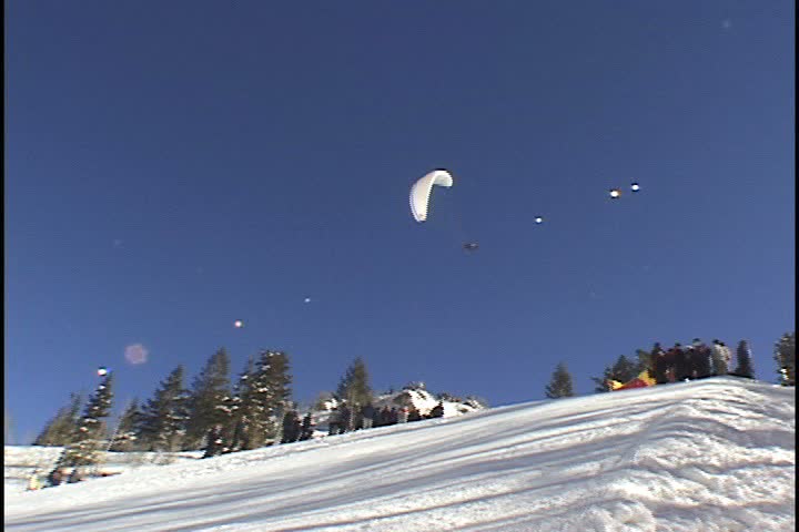 Snowbird, UT - January 2000: Red bull paraglider at "Huckfest" contest.
