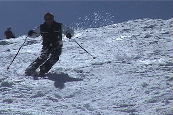 Park City, UT - April 1999: Members of the Professional Ski Instructors of America ski moguls during spring clinic.