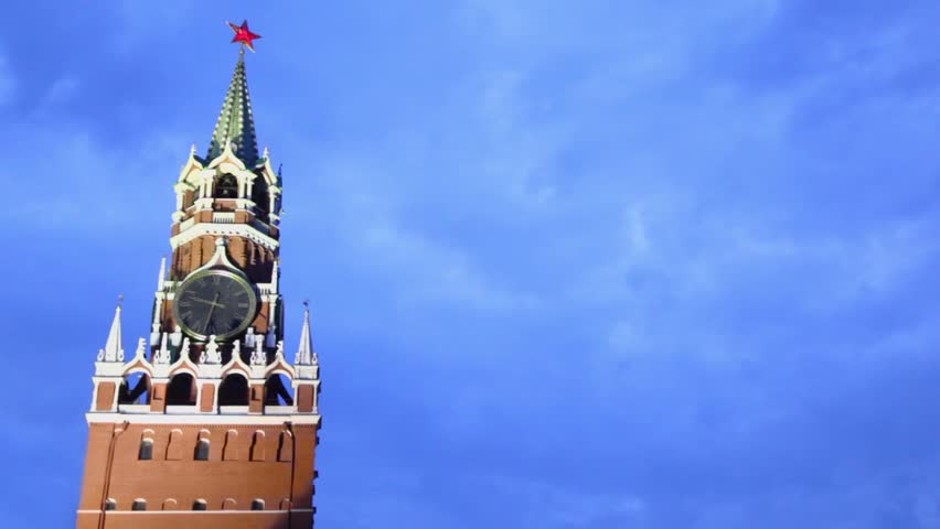 Red star on spire of Spasskaya tower with thirty two minutes past nine at clock in Moscow