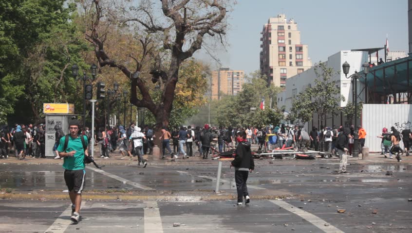 SANTIAGO, CHILE - OCTOBER 06: Chilean riot disperse protesters during a student strike on October 6, 2011 in Santiago, Chile. Protesters demand the government to improve education quality