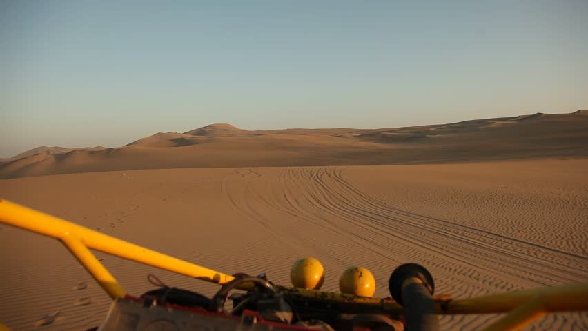 video footage of driving with a buggy off-road in the dunes of Ica, Peru
