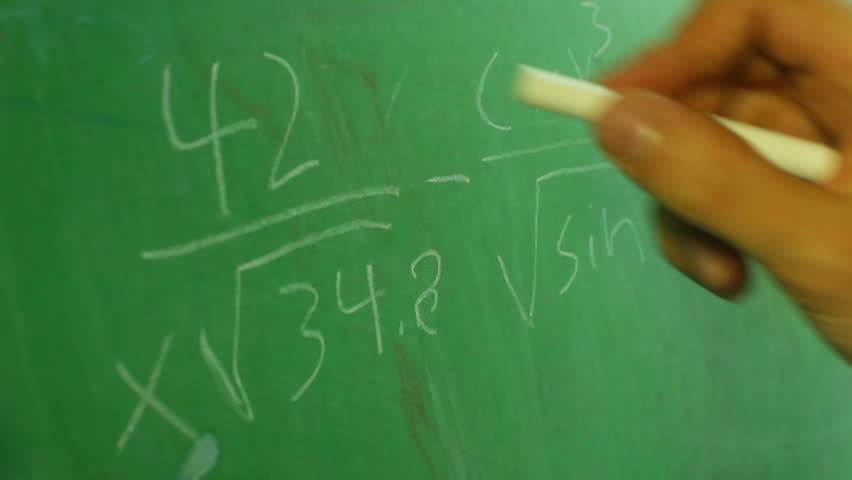 Doing math problems on a chalk board