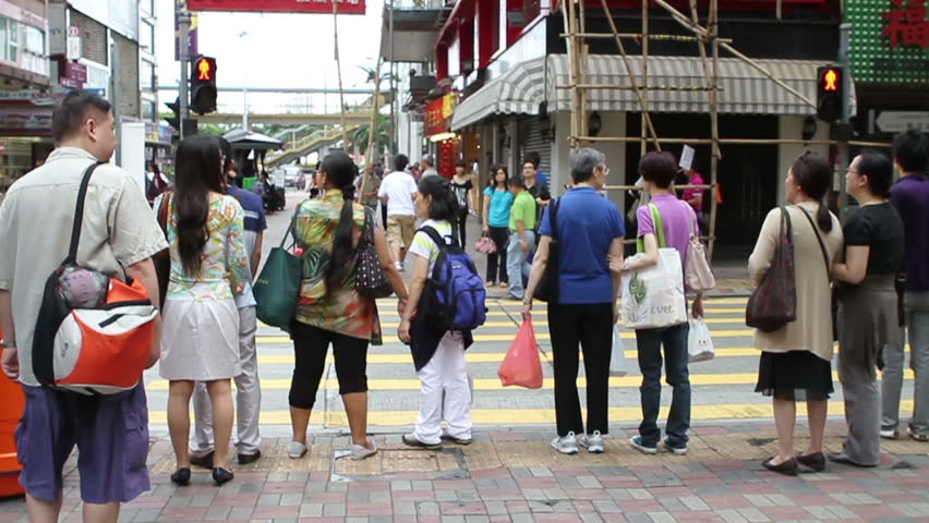HONG KONG - JULY 17: Peoples cross the street in Hong Kong's downtown, July 17, 2011. With sound. Filmed at 50 fps.