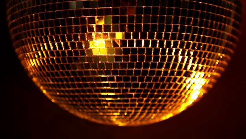 a funky discoball spinning and reflecting light. perfect clip for club visuals or party/celebration