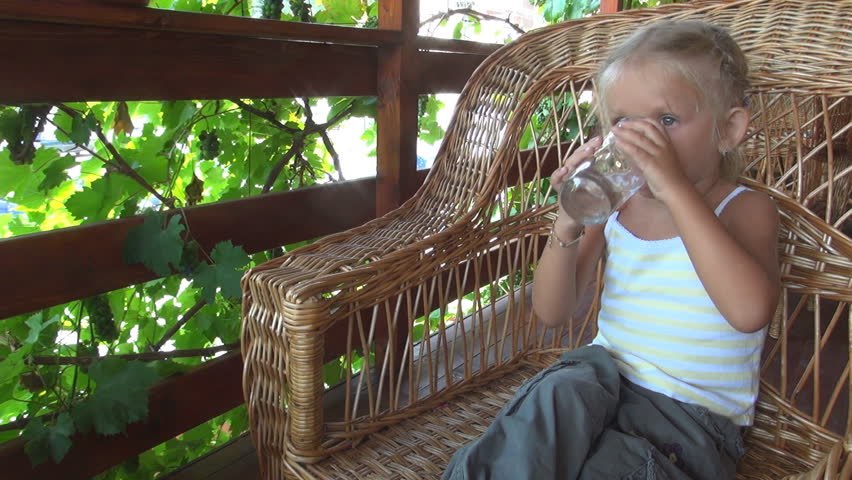 Child Drinking Water from Glass, Thirsty Little Girl Resting and Drinking Water