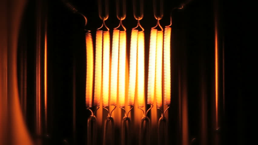 Light bulb of a 8mm film projector going slow motion on and out from dark to bright 