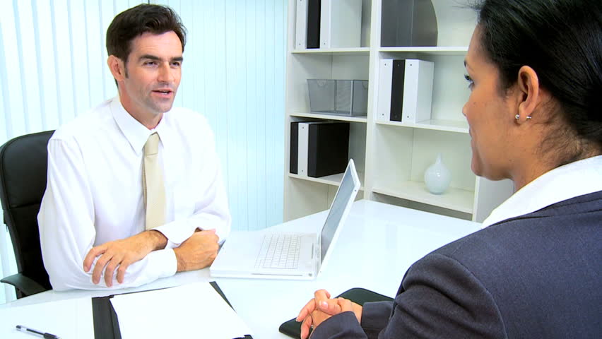 Hispanic male legal attorney meeting client modern law chambers