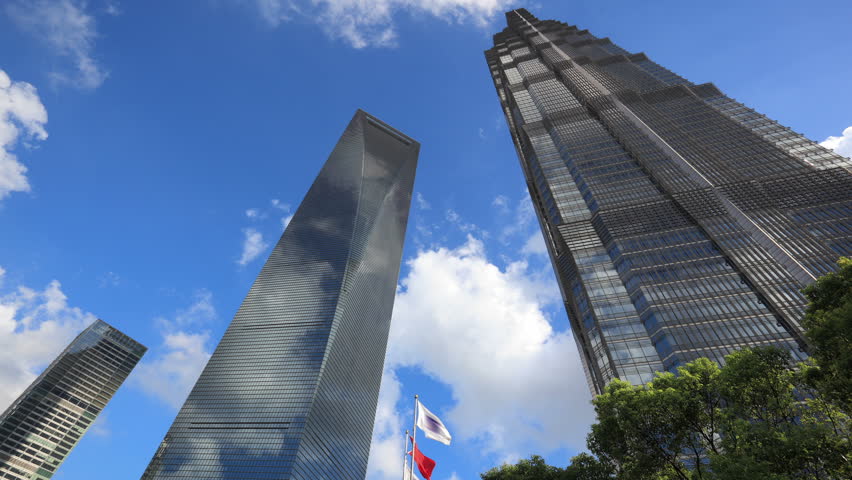 SHANGHAI - CIRCA JULY 2012: Time lapse of modern skyscrapers in the Lujiazui financial district of Pudong circa July 2012 in Shanghai, China.