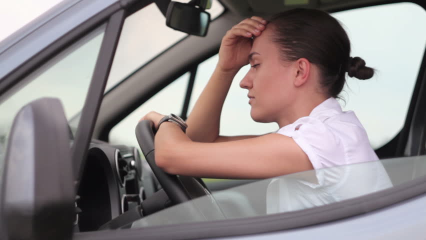 Sad businesswoman sitting in the car