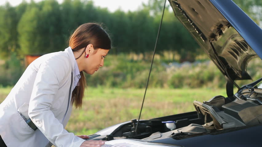 Woman with broken car