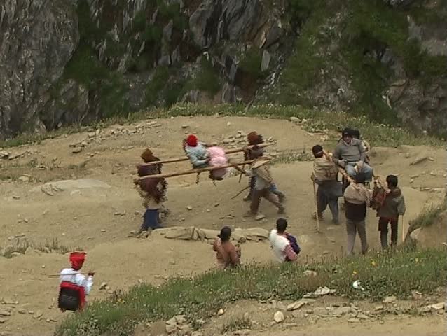 Porters carrying down pilgrims to the holy Amarnath cave in the Himalayas