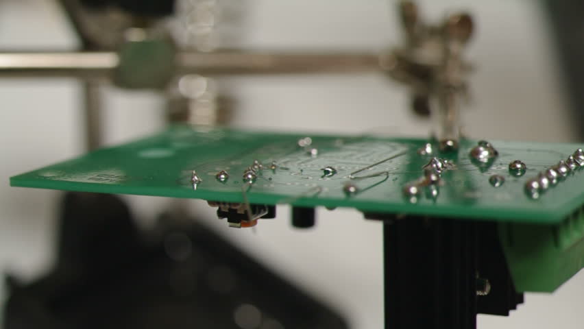 Soldering a circuit board.