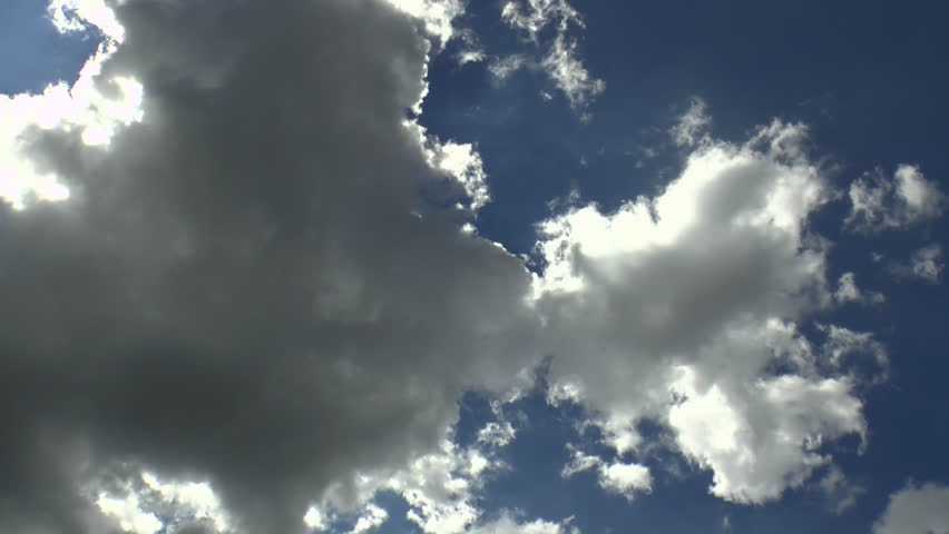 Time Lapse, Cloud mass breaks up, dissipates, reveals beautiful, shining, sun star effect, blue sky background. 1080p