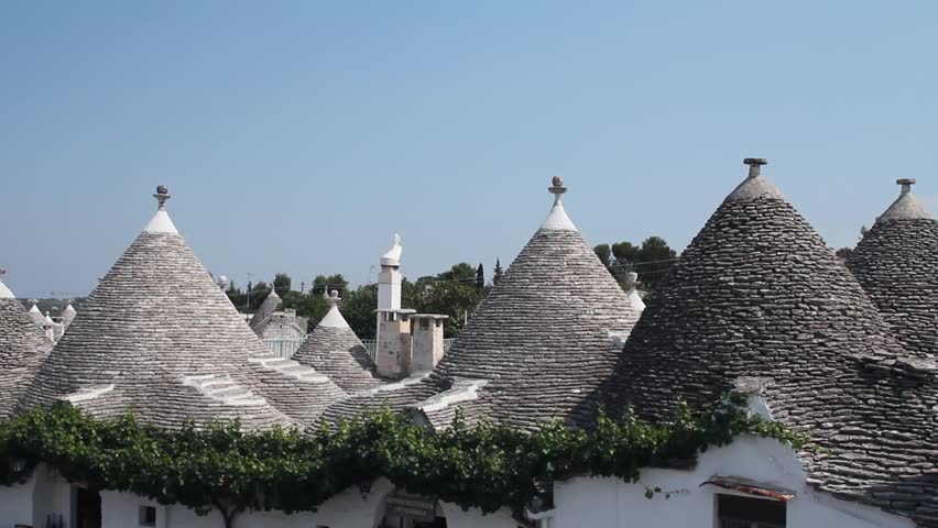 View of Alberobello and the trulli, a traditional apulian dry stone hut,  typical a specific part of the south of Italy
