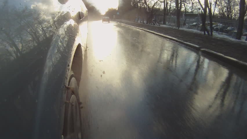 car goes through the puddles