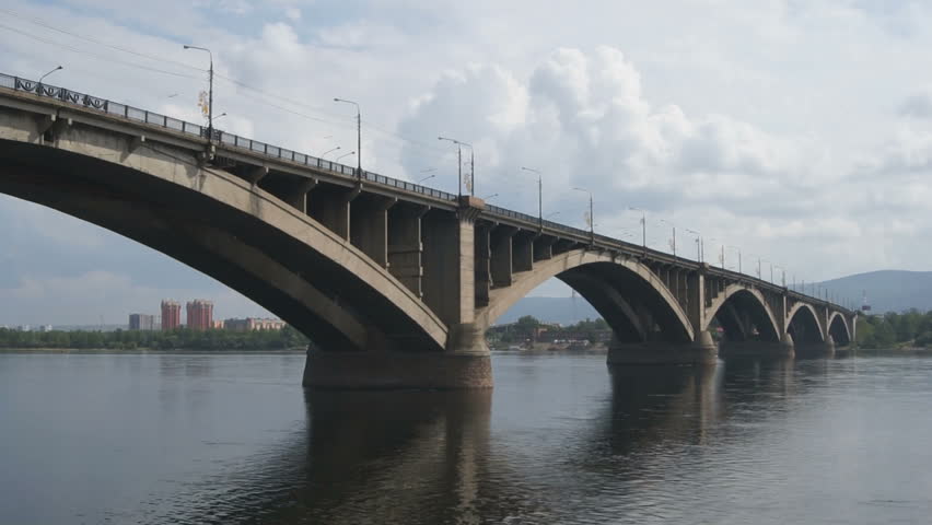 Bridge Over Yenisei River (05). Road "Communal" bridge over Yenisei River in the Russian Siberian city of Krasnoyarsk on the background of the cloudy sky summer day of 2012.