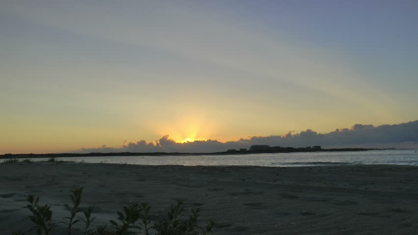 HD sunrise seen from carolina beach near inter-coastal waterway