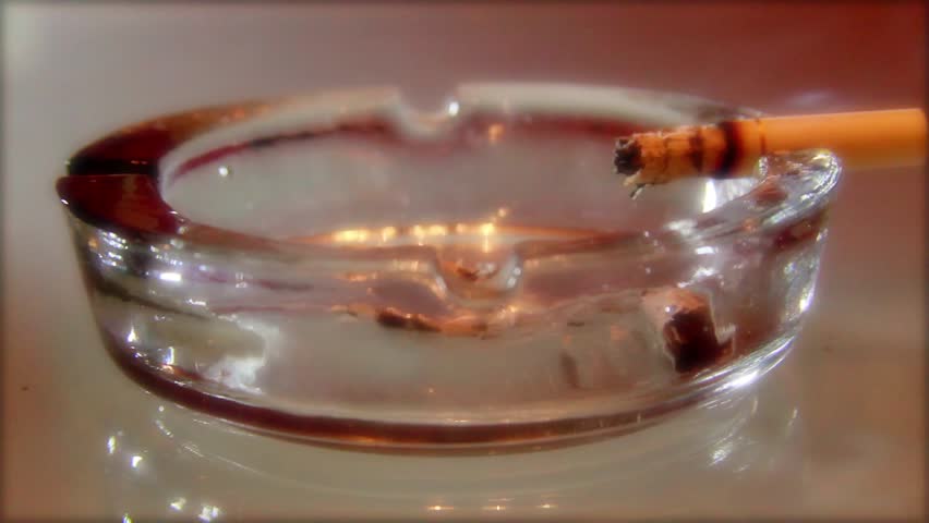 A burning cigarette in an ashtray 2
