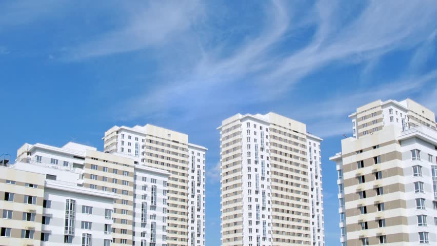 MOSCOW - AUG 6: (Timelapse View) Housing estate Ekopark Elk Island (Losiniy Ostrov) stands near trees against blue sky, builder Donstroy, on Aug 6, 2012 in Moscow, Russia