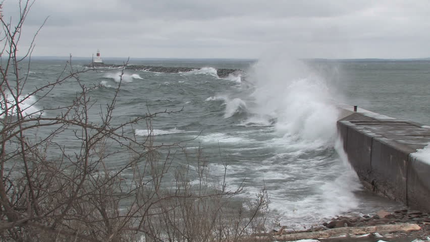 Lake Superior break wall and light beacon during storm in HD