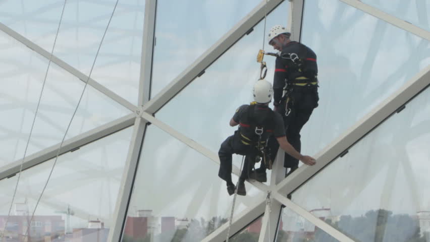 VALENCIA, SPAIN - MAY 3: Safety workers give a demonstration on climbing equipment at the Laboralia Work Place Safety Trade Show on May 3, 2011 in Valencia, Spain.